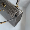 KELLY 25 SHINY (LISSE) NILOTICUS CROCODILE LEATHER GRIS TOURTERELLE WITH GOLD HARDWARE (GHW)